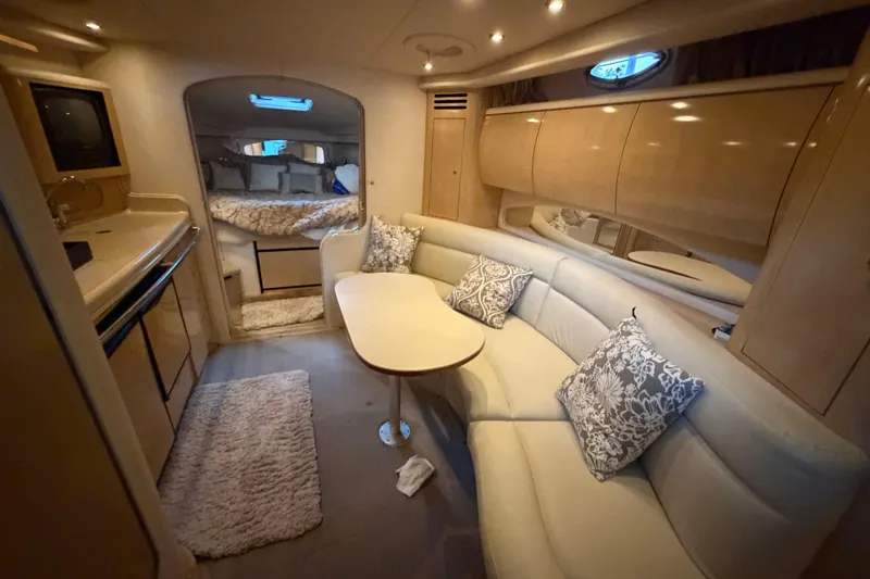 Slide: The Image of Luxurious interior of 2002 Sea Ray 360 Sundancer yacht with cozy seating and elegant decor. - 32