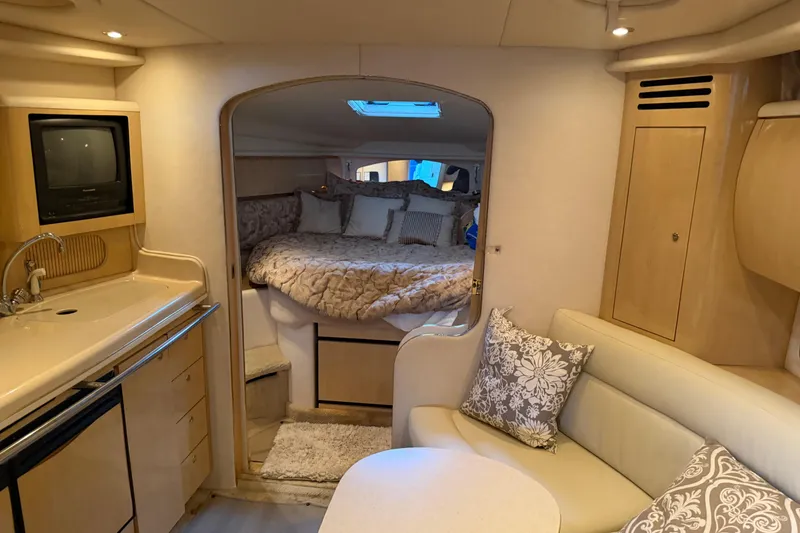 Slide: The Image of Interior of 2002 Sea Ray 360 Sundancer yacht with cozy seating and sleeping area. - 34