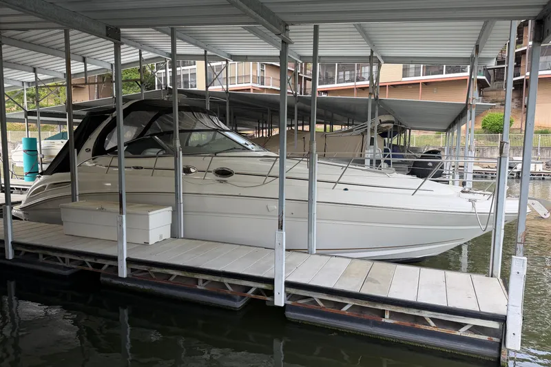 Slide: The Image of 2002 Sea Ray 360 Sundancer docked in a covered marina slip. - 5