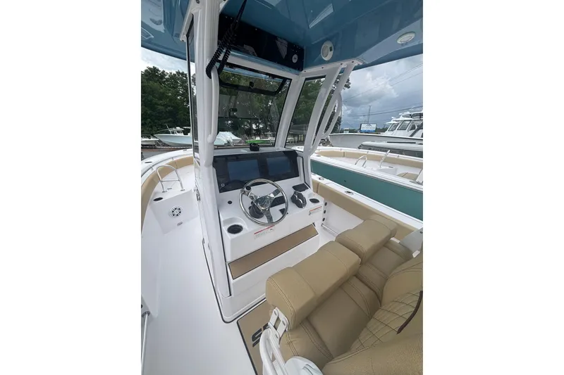 Slide: The Image of 2025 Sportsman Heritage 231 Center Console interior with modern helm and seating. - 6