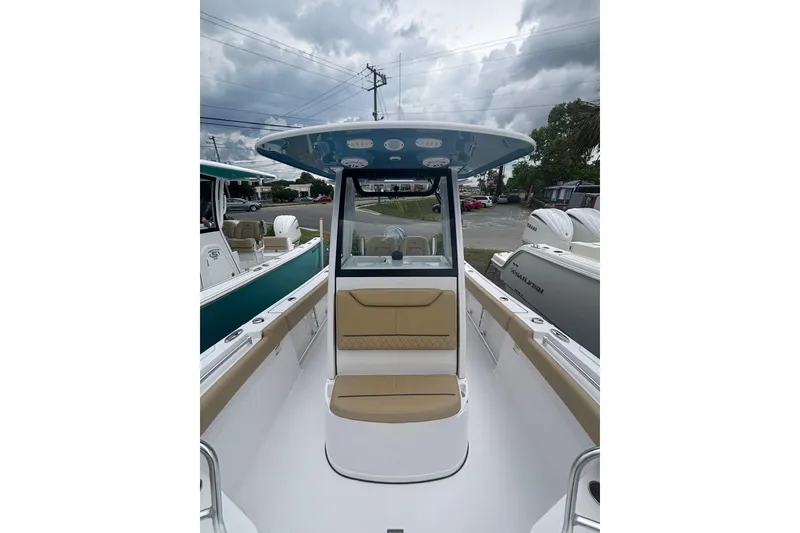 Slide: The Image of 2025 Sportsman Heritage 231 Center Console boat with sleek design and spacious seating. - 9