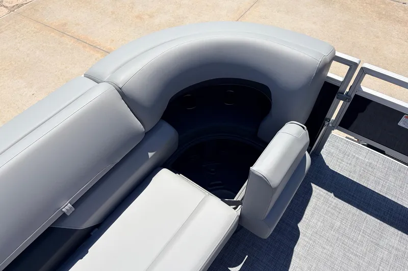 Slide: The Image of 2026 Sun Tracker SportFish 22 DLX boat seating area with gray upholstery. - 14
