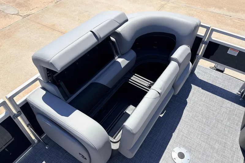 Slide: The Image of 2026 Sun Tracker SportFish 22 DLX boat interior with open storage compartment. - 16