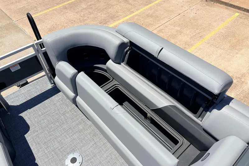 Slide: The Image of 2026 Sun Tracker SportFish 22 DLX boat interior with open storage compartments. - 23