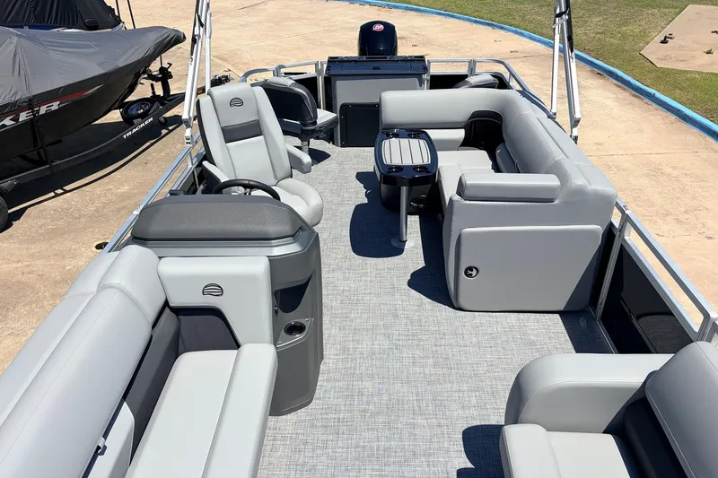 Slide: The Image of 2026 Sun Tracker SportFish 22 DLX pontoon boat with spacious seating and modern design. - 24