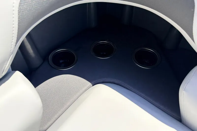 Slide: The Image of 2026 Sun Tracker SportFish 22 DLX boat interior with three cup holders. - 29