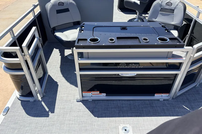 Slide: The Image of 2026 Sun Tracker SportFish 22 DLX pontoon boat interior with seating and fishing station. - 41