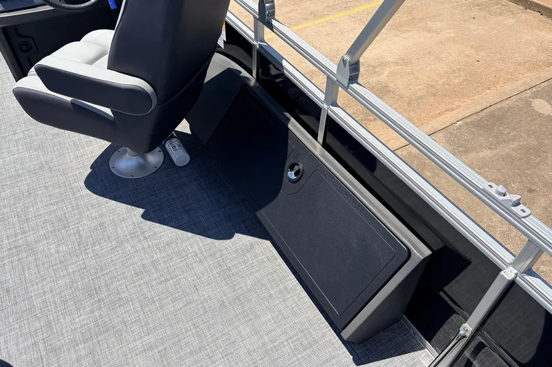 Slide: The Image of 2026 Sun Tracker SportFish 22 DLX boat interior with gray seating and flooring. - 50