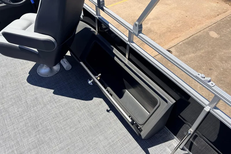 Slide: The Image of 2026 Sun Tracker SportFish 22 DLX boat interior with seating and storage compartment. - 51