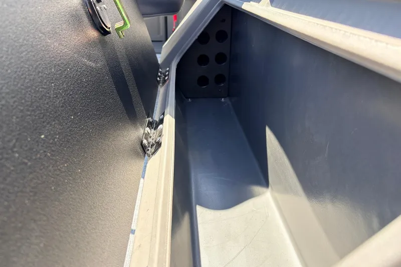 Slide: The Image of Storage compartment of 2026 Sun Tracker SportFish 22 DLX boat, featuring durable construction. - 52