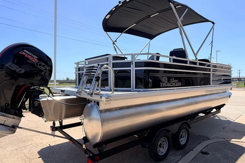 Slide: The Image of 2026 Sun Tracker SportFish 22 DLX pontoon boat with Mercury 150 engine on trailer. - 6