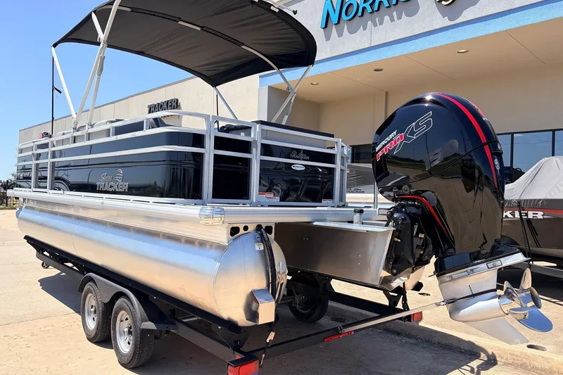 Slide: The Image of 2026 Sun Tracker SportFish 22 DLX pontoon boat with Mercury Pro XS engine on trailer. - 8