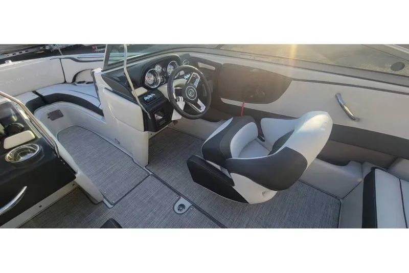 Slide: The Image of Interior of 2024 Crownline 210 SS boat, featuring sleek design and modern dashboard. - 16