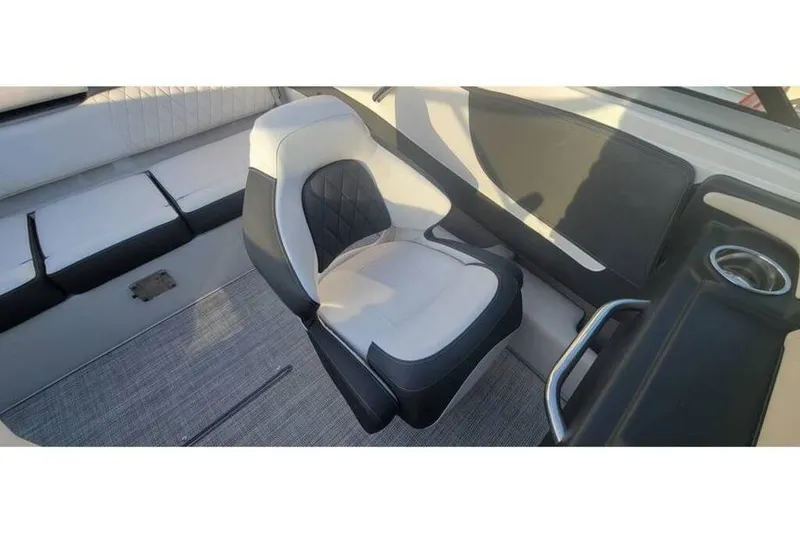 Slide: The Image of 2024 Crownline 210 SS boat interior with stylish seating and modern design. - 18