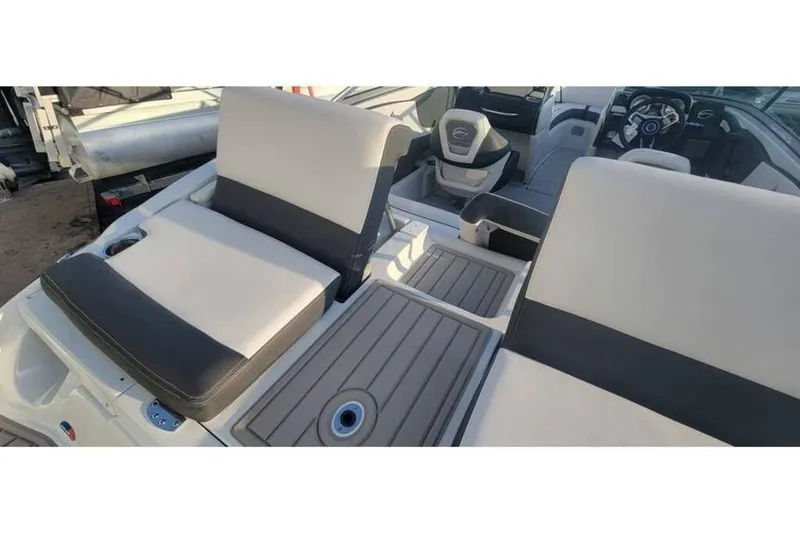 Slide: The Image of 2024 Crownline 210 SS boat interior with sleek seating and modern design. - 9
