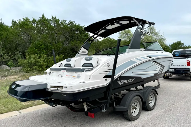 Slide: The Image of 2019 Chaparral Vortex 223 VRX boat on trailer, parked on roadside. - 11