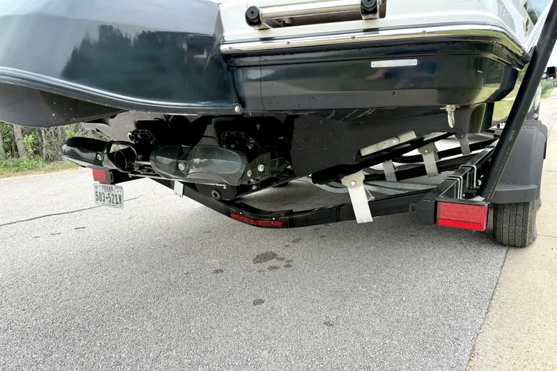 Slide: The Image of Rear view of a 2019 Chaparral Vortex 223 VRX boat on a trailer. - 13
