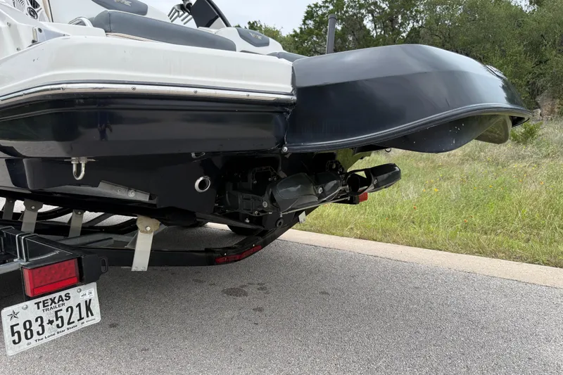 Slide: The Image of Rear view of a 2019 Chaparral Vortex 223 VRX boat on a trailer. - 14
