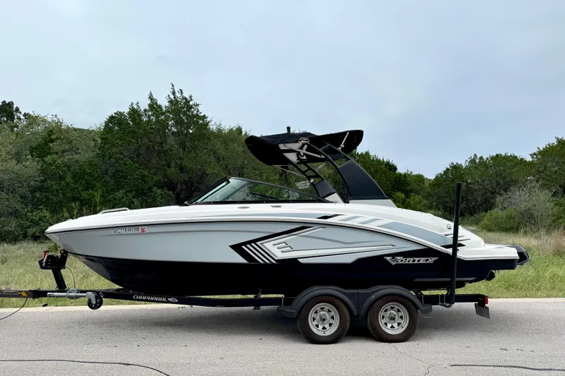Slide: The Image of 2019 Chaparral Vortex 223 VRX boat on trailer, parked on roadside. - 16