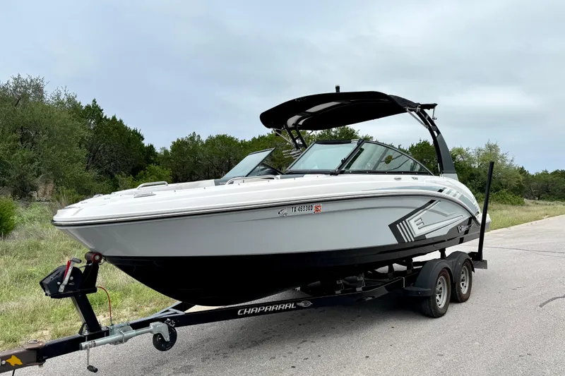 Slide: The Image of 2019 Chaparral Vortex 223 VRX boat on trailer, parked on roadside. - 17