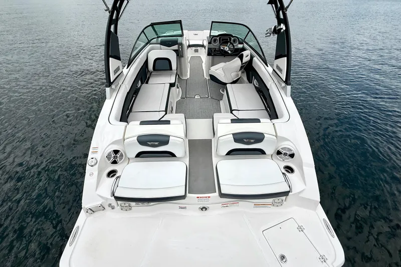 Slide: The Image of 2019 Chaparral Vortex 223 VRX boat interior with seating, on calm water. - 20