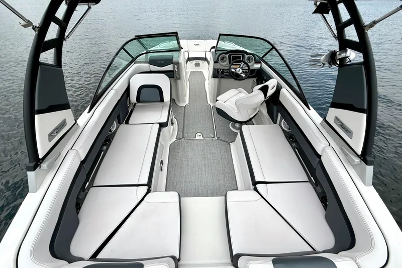 Slide: The Image of 2019 Chaparral Vortex 223 VRX boat interior with sleek seating and modern dashboard. - 21