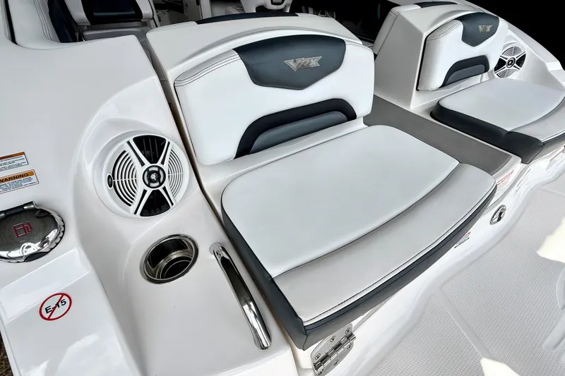 Slide: The Image of 2019 Chaparral Vortex 223 VRX boat interior with cushioned seating and speaker system. - 28