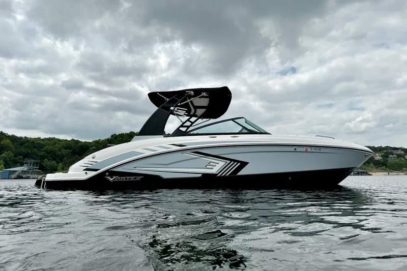 Slide: The Image of 2019 Chaparral Vortex 223 VRX boat on water under cloudy sky. - 3