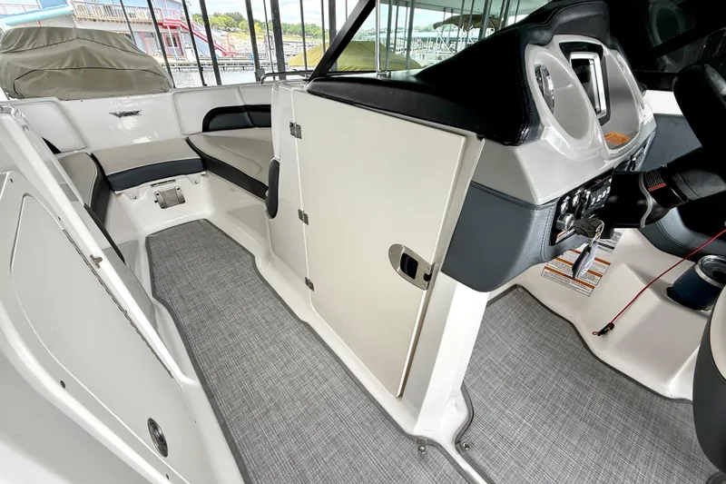 Slide: The Image of 2019 Chaparral Vortex 223 VRX interior with seating and helm, showcasing modern design. - 30