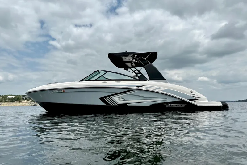 Slide: The Image of 2019 Chaparral Vortex 223 VRX boat on calm water under cloudy sky. - 7