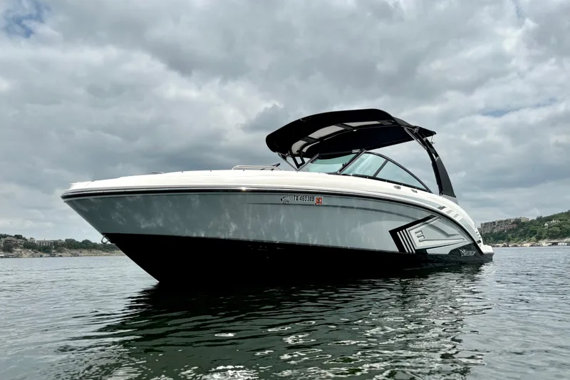 Slide: The Image of 2019 Chaparral Vortex 223 VRX boat on water under cloudy sky. - 8