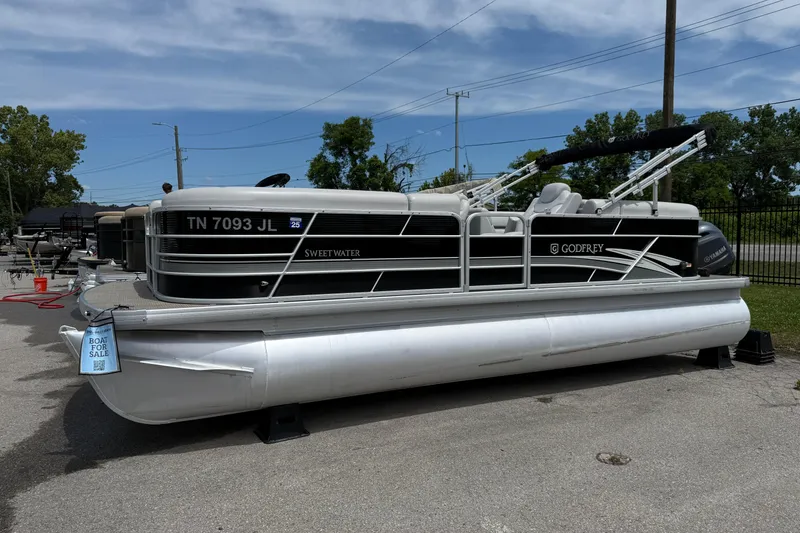 The Image of 2022 Godfrey Sweetwater 2286 SB pontoon boat for sale, parked outdoors. - 0