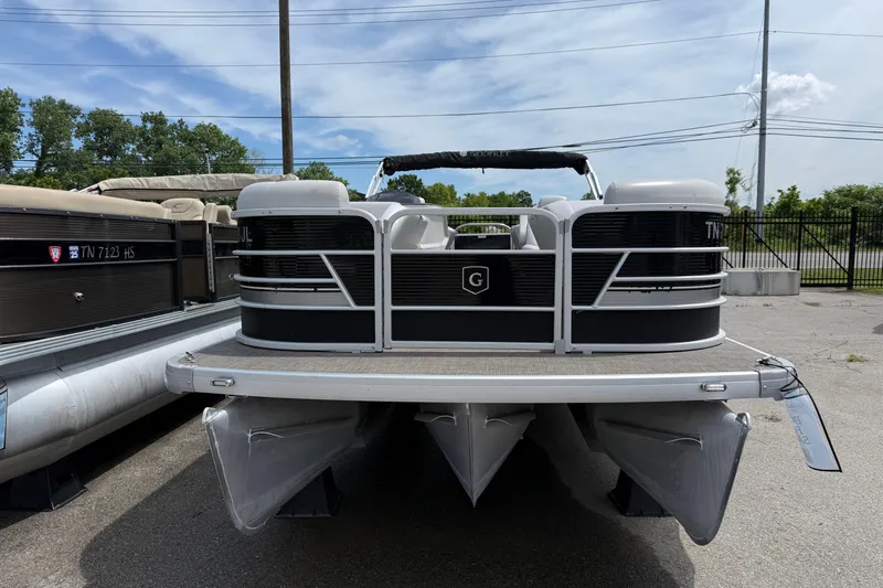 Slide: The Image of 2022 Godfrey Sweetwater 2286 SB pontoon boat parked outdoors. - 1