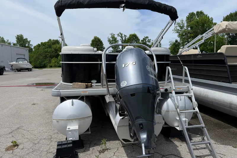 Slide: The Image of 2022 Godfrey Sweetwater 2286 SB pontoon boat with 175 HP engine, docked outdoors. - 3