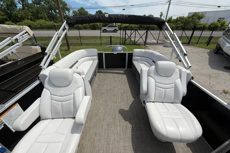 Slide: The Image of 2022 Godfrey Sweetwater 2286 SB pontoon boat with white seating and spacious deck. - 7