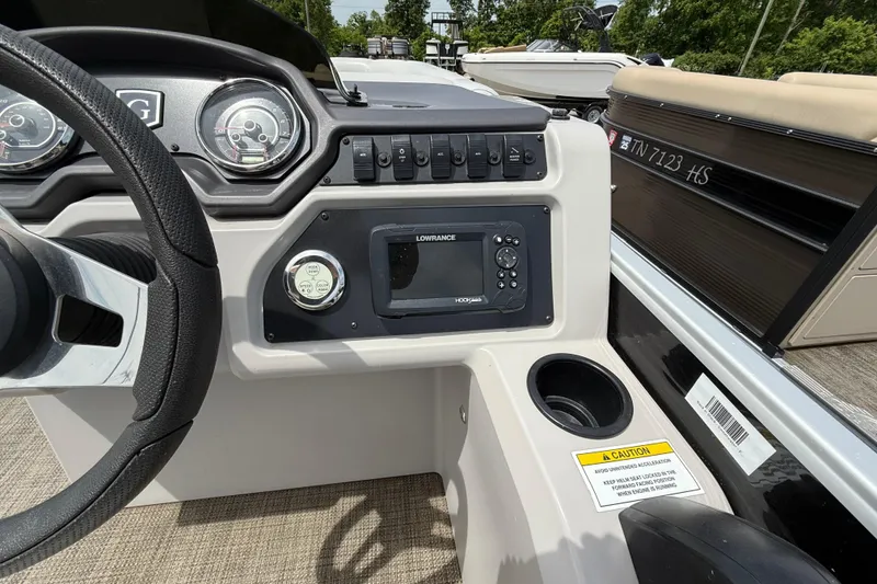 Slide: The Image of Steering console of 2022 Godfrey Sweetwater 2286 SB boat with gauges and Lowrance display. - 9