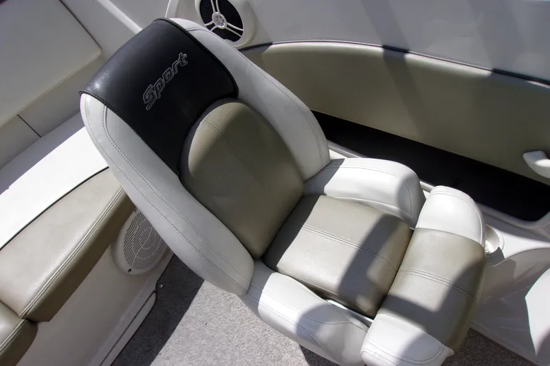 Slide: The Image of 2007 Sea Ray 185 Sport boat seat with "Sport" logo, featuring white and gray upholstery. - 10
