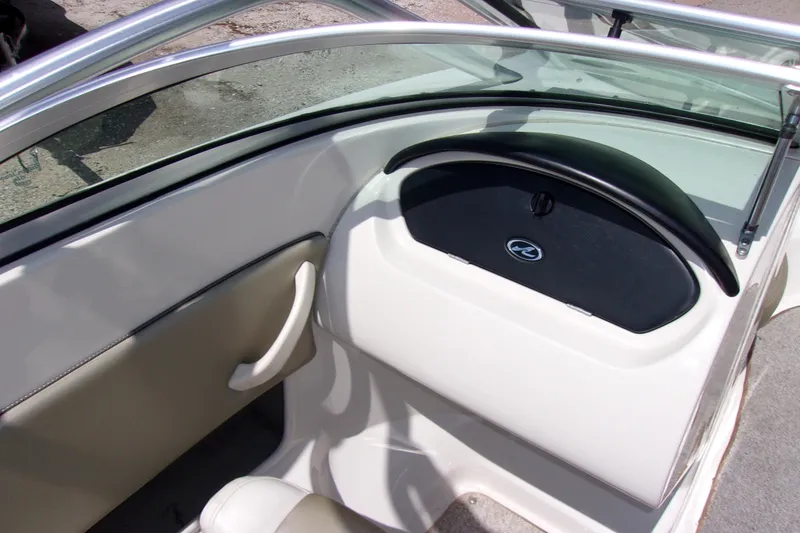Slide: The Image of Interior view of a 2007 Sea Ray 185 Sport boat dashboard and seating area. - 11