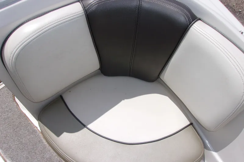 Slide: The Image of 2007 Sea Ray 185 Sport boat seating with white and black upholstery. - 16