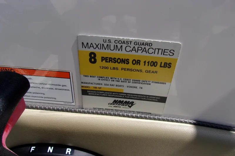 Slide: The Image of 2007 Sea Ray 185 Sport capacity label, 8 persons or 1100 lbs, U.S. Coast Guard compliant. - 17