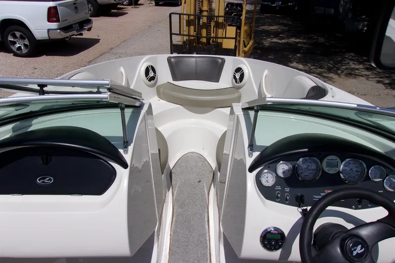 Slide: The Image of 2007 Sea Ray 185 Sport boat interior with dashboard and seating area. - 5