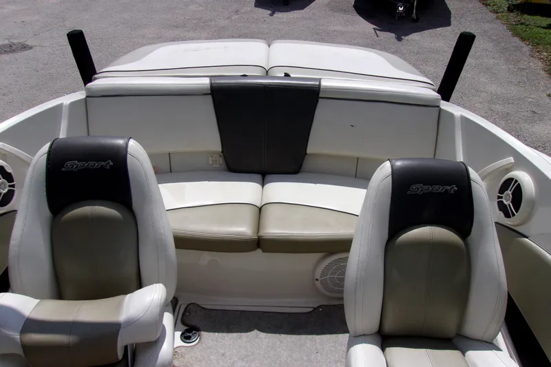 Slide: The Image of Interior of a 2007 Sea Ray 185 Sport boat with seating and speakers. - 6