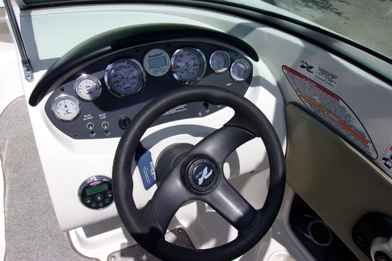 Slide: The Image of Steering wheel and dashboard of a 2007 Sea Ray 185 Sport boat. - 7