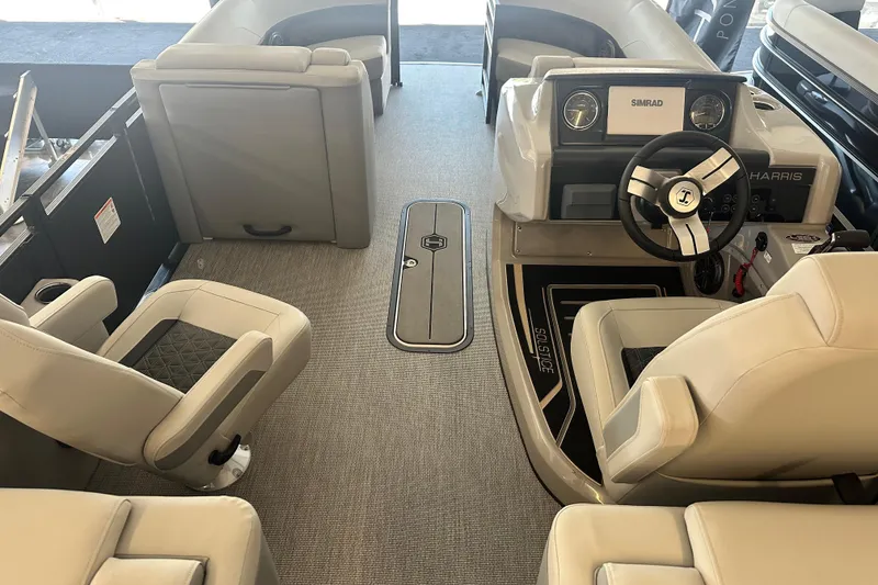Slide: The Image of Interior of 2026 Harris Solstice 230 CWDH boat with modern seating and steering console. - 7
