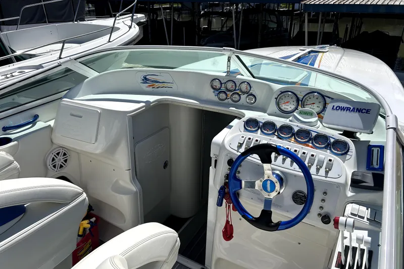 Slide: The Image of 2007 Sunsation 32 Dominator boat cockpit with steering wheel and instrument panel. - 11