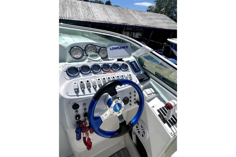 Slide: The Image of 2007 Sunsation 32 Dominator boat dashboard with gauges and steering wheel. - 12