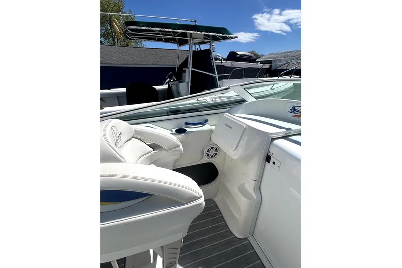 Slide: The Image of 2007 Sunsation 32 Dominator boat interior with white seating and sleek design. - 14