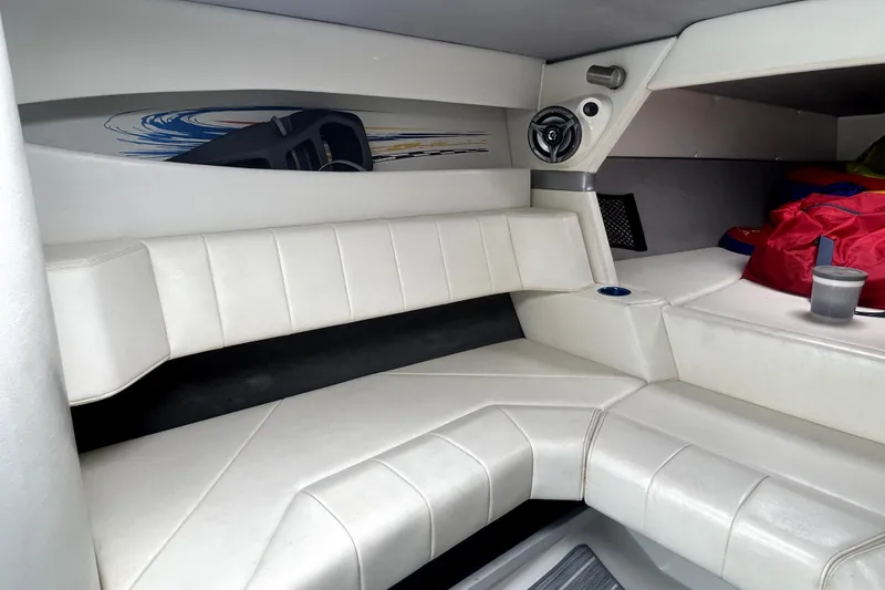 Slide: The Image of Interior of a 2007 Sunsation 32 Dominator boat with white leather seating. - 20