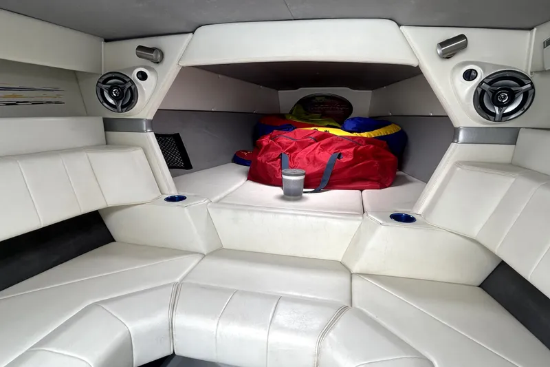 Slide: The Image of Interior of 2007 Sunsation 32 Dominator boat with white seating and speakers. - 21