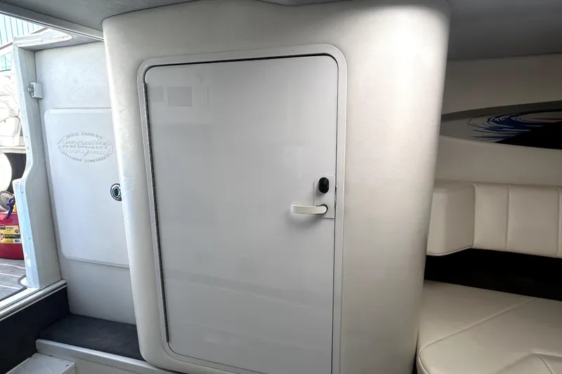 Slide: The Image of 2007 Sunsation 32 Dominator cabin interior with sleek white door and seating area. - 22